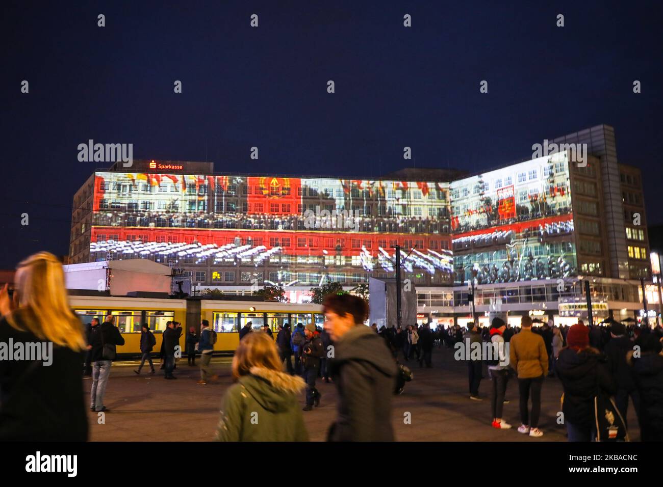 Historic pictures and quotes are projected on the buildings at Alexanderplatz for the upcoming 30th anniversary of the fall of the Berlin Wall. Berlin, Germany on 8 November, 2019. (Photo by Beata Zawrzel/NurPhoto) Stock Photo