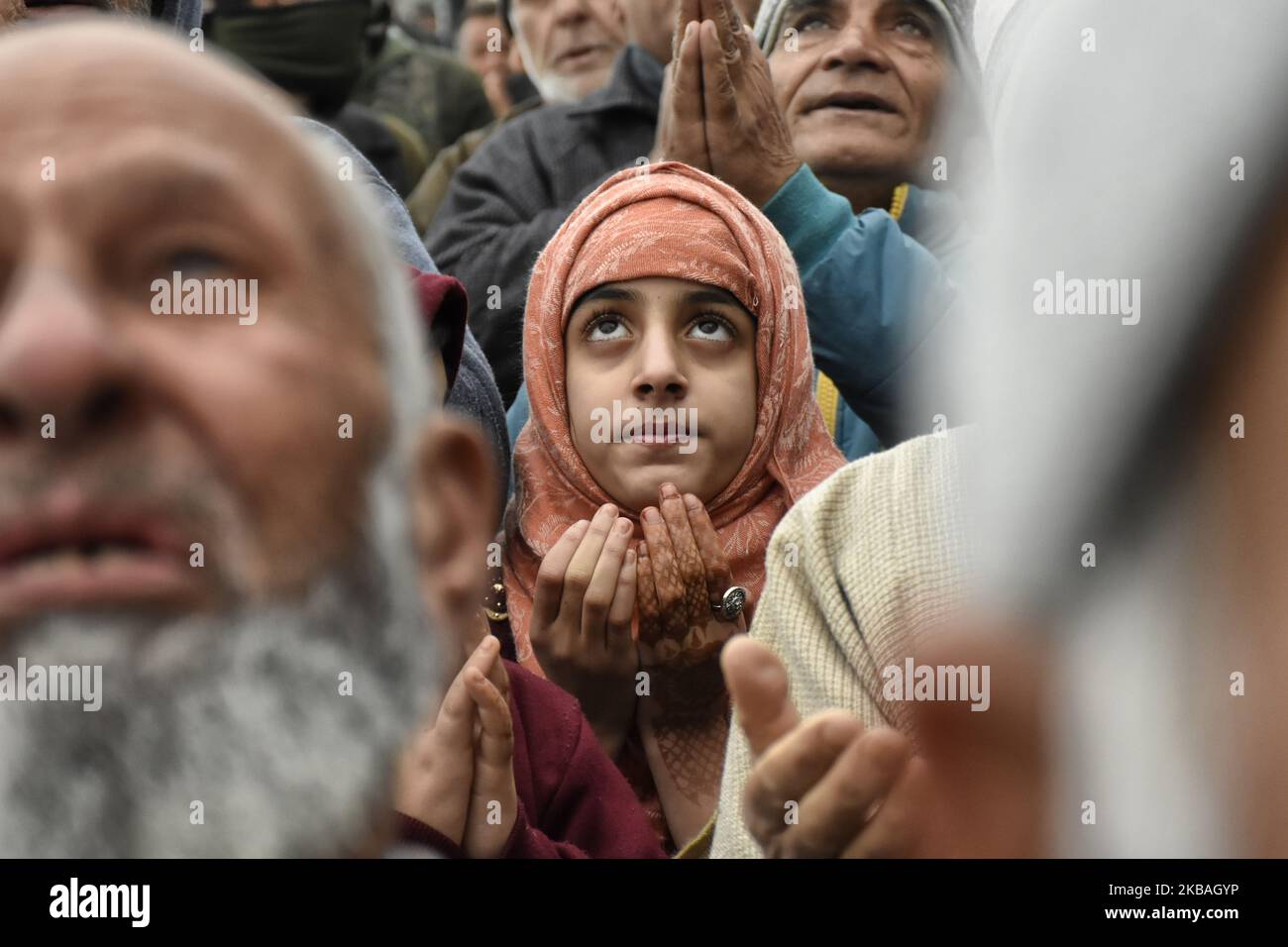 A Kashmiri girl pray on the eve of Eid E Milad Ul Nabi at Hazratbal