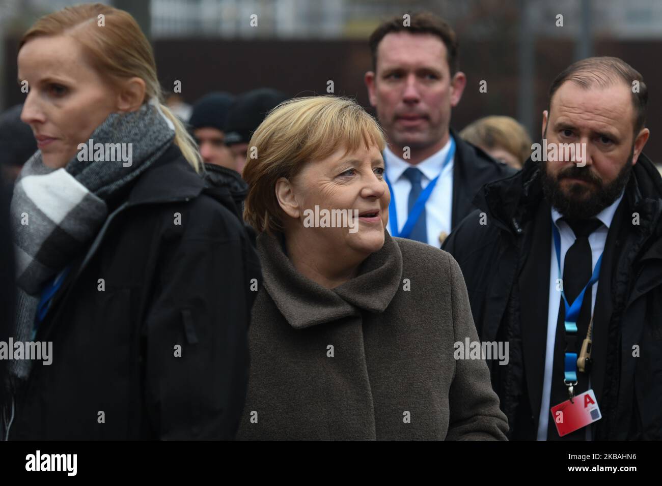 Angela Merkel (Center), Germany's Chancellor, surrounded by her protection guards, meets members of the public outside the Berlin Wall Memorial at Bernauer Strasse during a commemoration ceremony for the 30th anniversary of the fall of the Berlin Wall. On Saturday, November 9, 2019, in Berlin, Germany. (Photo by Artur Widak/NurPhoto) Stock Photo