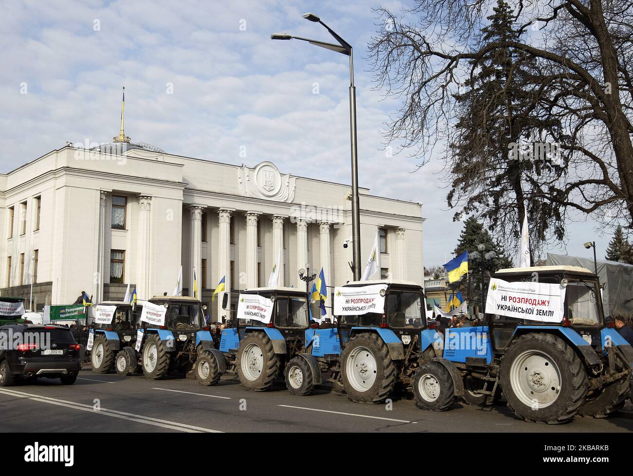 Farmer's tractors with placards reading 'No of the selling of Ukrainian ...
