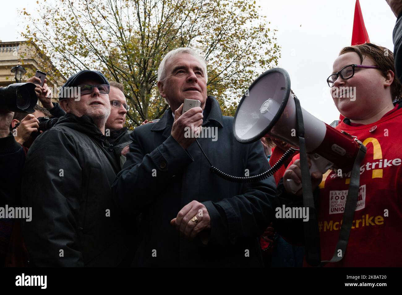 Shadow Chancellor John McDonnell takes part in a rally as McDonald's employees, trade unionists and campaigners for fast food workers' rights gather outside Downing Street on 12 November, 2019 in London, England. Members of the Bakers, Food and Allied Workers Union (BFAWU) walked out of six McDonald's stores in London today over a ?15 an hour minimum wage, choice of guaranteed working hours and union rights. (Photo by WIktor Szymanowicz/NurPhoto) Stock Photo