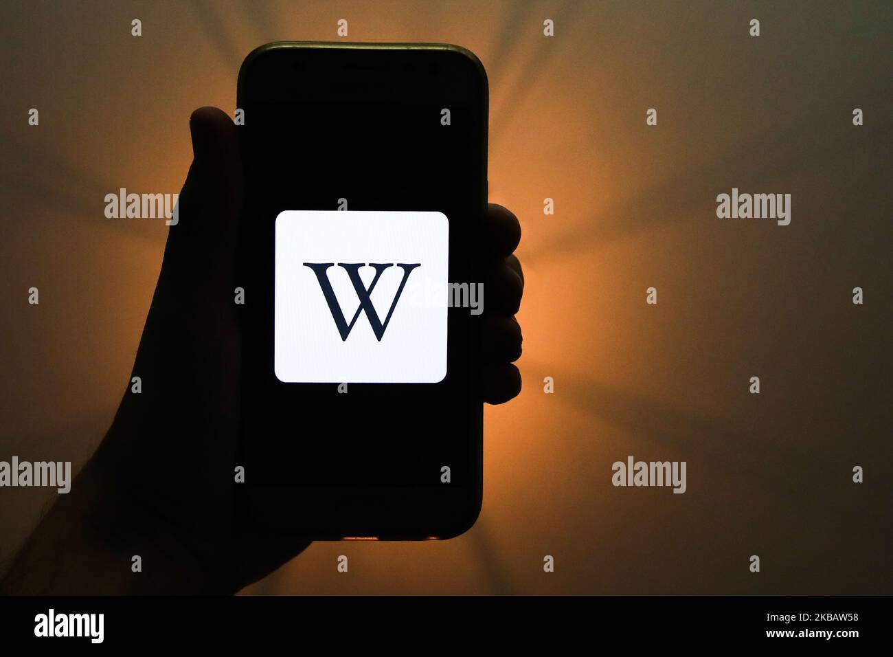 Wikipedia logo is seen displayed on a phone screen in this illustration photo taken in Krakow, Poland on November 13, 2019. (Photo Illustration by Jakub Porzycki/NurPhoto) Stock Photo