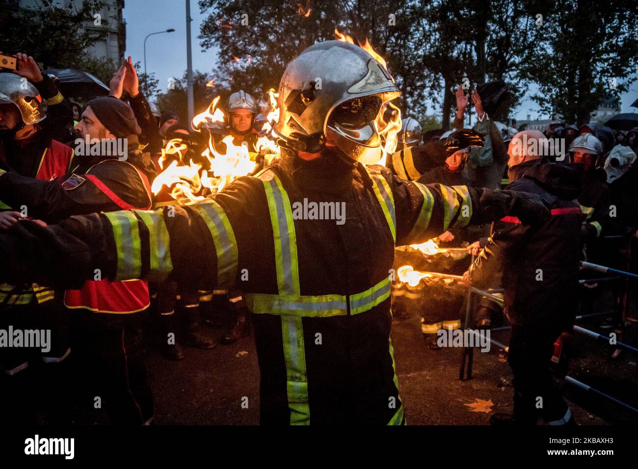 Demonstration of emergency personnel as part of a national day of action in Lyon, France, on November 14, 2019. Many sectors of hospital services, emergency services, the SAMU or the fire brigade marched to ask for more financial resources to accomplish their missions. Police used tear gas against firefighters trying to reach the prefecture at the end of the demonstration. (Photo by Nicolas Liponne/NurPhoto) Stock Photo