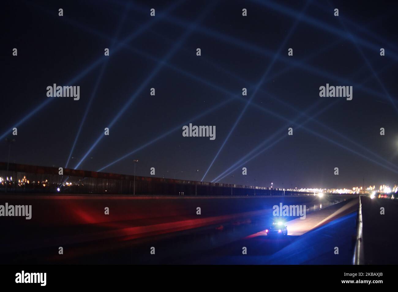 A Interactive Art installation titled 'Border Tuner' installed on November 13 in Juarez, Mexico, after two years of preparation. Mexican artist places a bridge of light between Ciudad Juarez and El Paso Texas, the Mexican artist Rafael Lozano Hemmer placed a series of lights that form a bridge. It is part of a performance installation called border tuner. The people who attend can transmit a message that through a speaker connected via Wi-Fi transmit it to the other side on both roads, Ciudad Juarez El Paso Texas, El Paso Texas Ciudad Juarez. (Photo by David Peinado/NurPhoto) Stock Photo