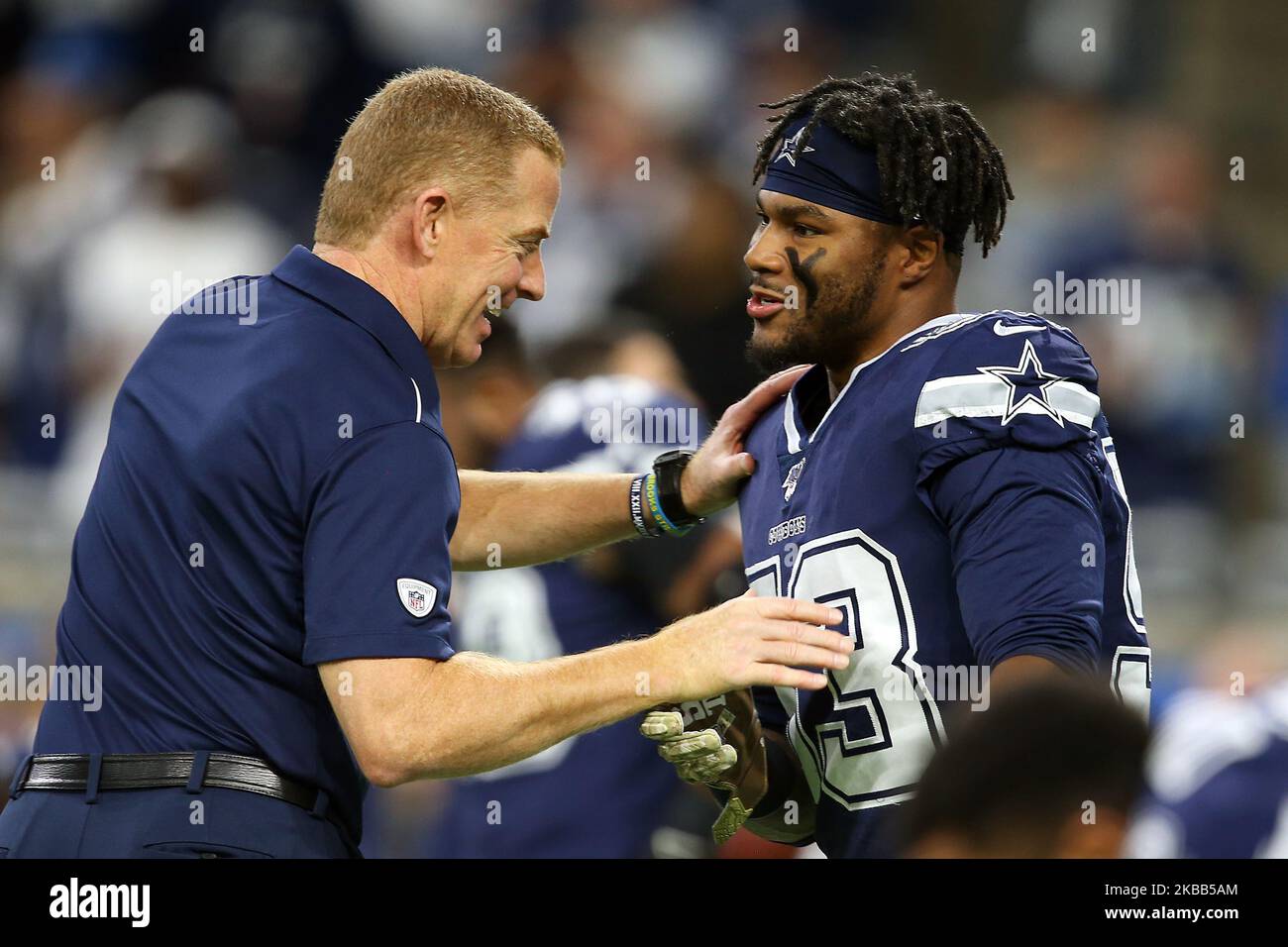 Dallas Cowboys head coach Jason Garrett greets Dallas Cowboys linebacker Justin March-Lillard (53) during warmups before the first half of an NFL football game against the Detroit Lions in Detroit, Michigan USA, on Sunday, November 17, 2019. (Photo by Amy Lemus/NurPhoto) Stock Photo