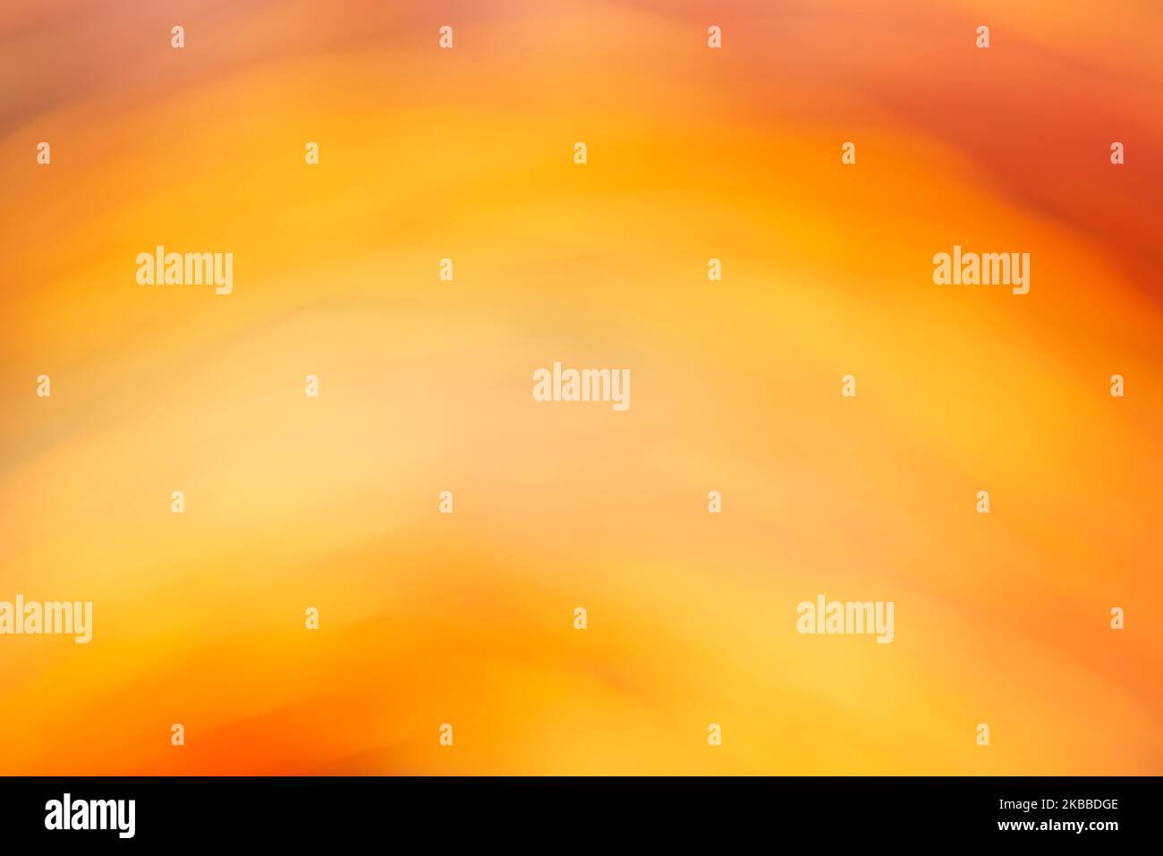 Artistic abstract warm background in vivid orange and yellow colors. Smooth and flowing design, modern and vibrant. Stock Photo