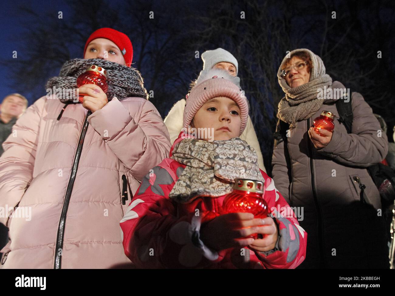 Children place candles and paid tribute to the victims of the 1932-1933 Holodomor (Great Famine in Ukraine 1932-33) at a Monument to the Victims of the Holodomor in Kyiv, Ukraine, on 23 November 2019. Ukrainians mark the anniversary of the Great Famine in Soviet Ukraine 1932-33, which many regard as a genocide ordered by then Soviet leader Joseph Stalin, where millions Ukrainians died in starvation catastrophe, unprecedented in the history of Ukraine. (Photo by STR/NurPhoto) Stock Photo