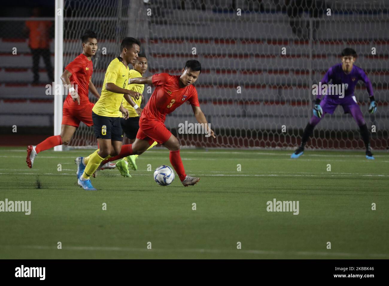 Ye Min Thu (3) of Myanmar and Muhammad Danial Haqim Aman of Malaysia in action during the elimination round of the Men’s football for the 30th South East Asian Games held at the Rizal Memorial Complex in Manila, Philippines on November 25, 2019. (Photo by George Calvelo/NurPhoto) Stock Photo