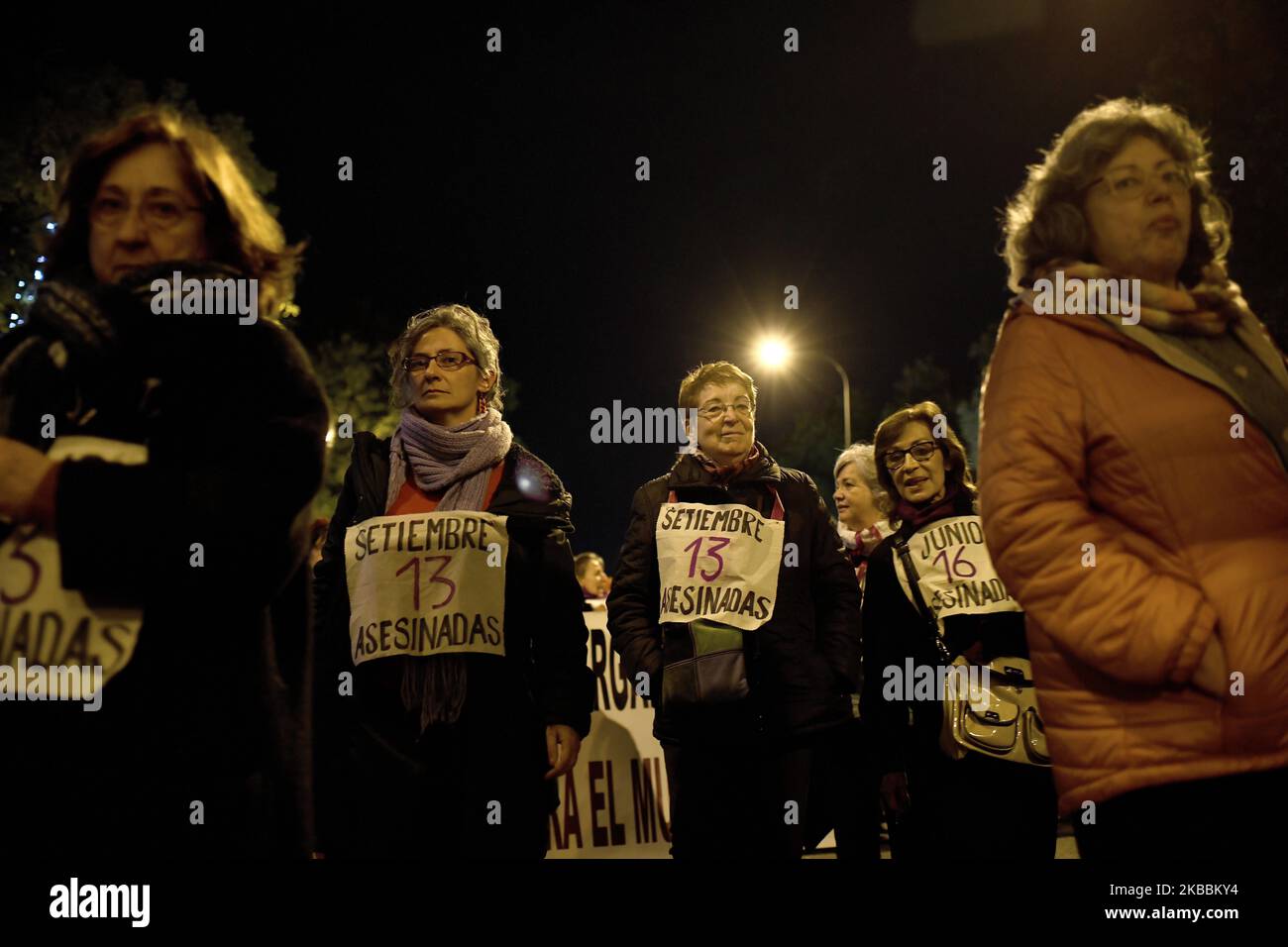 Women hold a placard reading « September, 13 Women Killed » during a protest to condemn violence against women in the streets of Madrid, on 25th November 2019 (Photo by Juan Carlos Lucas/NurPhoto) Stock Photo