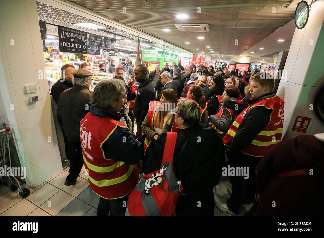French General Confederation of Labour (CGT) union members demonstrate inside Casino supermarket in the 13th arrondissement of Paris on November 26, 2019, against the deterioration in working conditions and the take over by the German group Aldi of 700 Leader Price stores, one of the group's subsidiaries.The Casino Group confirmed on September 19, 2019, the existence of discussions with the Aldi France group concerning the acquisition of Leader Price. (Photo by Michel Stoupak/NurPhoto) Stock Photo