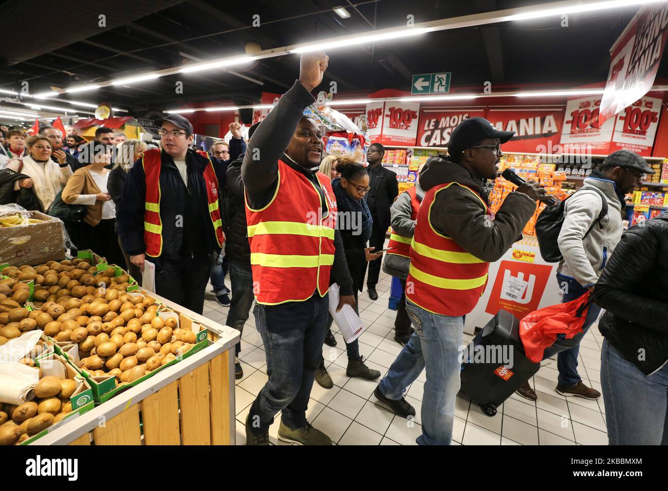 French General Confederation of Labour (CGT) union members walk inside Casino supermarket in the 13th arrondissement of Paris on November 26, 2019, during a demonstration against the deterioration in working conditions and the take over by the German group Aldi of 700 Leader Price stores, one of the group's subsidiaries.The Casino Group confirmed on September 19, 2019, the existence of discussions with the Aldi France group concerning the acquisition of Leader Price. (Photo by Michel Stoupak/NurPhoto) Stock Photo