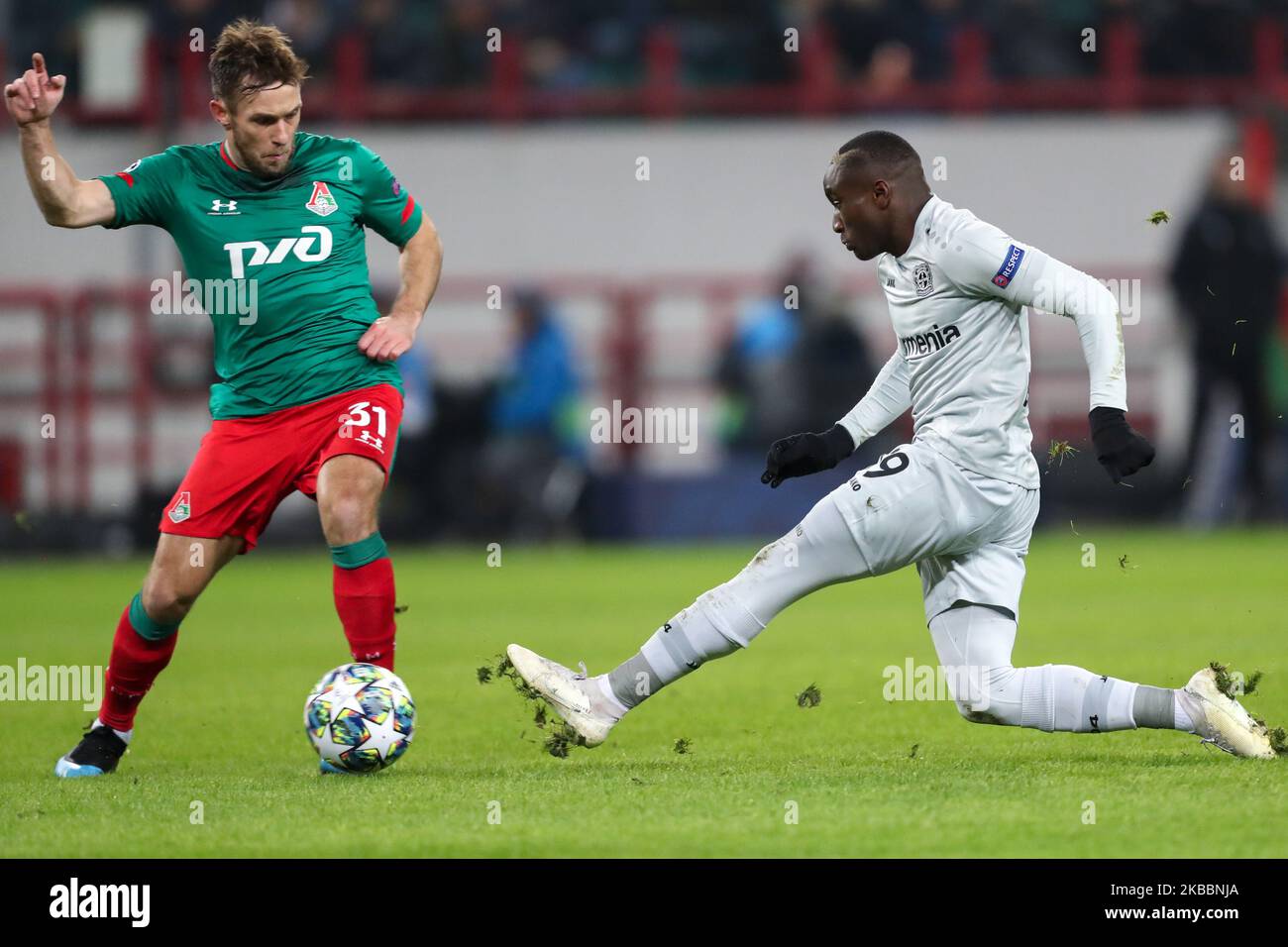 Maciej Rybus of FC Lokomotiv Moskva (L) and Moussa Diaby of Bayer Leverkusen vie for the ball during the UEFA Champions League group D match between FC Lokomotiv Moskva and Bayer Leverkusen at RZD Arena on November 26, 2019 in Moscow, Russia. (Photo by Igor Russak/NurPhoto) Stock Photo