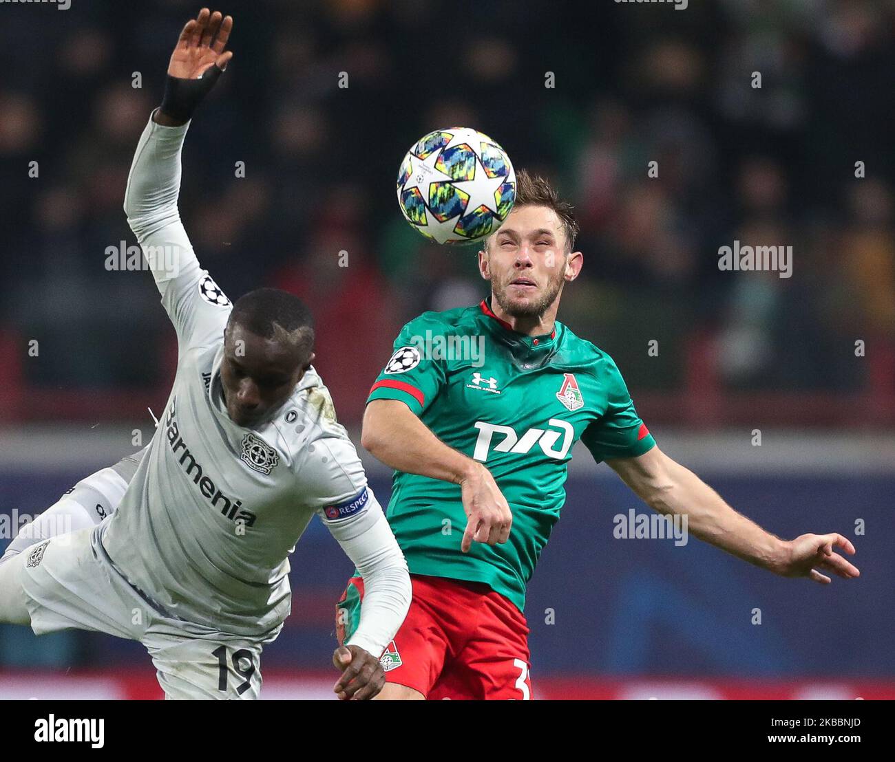 Moussa Diaby of Bayer Leverkusen (L) and Maciej Rybus of FC Lokomotiv Moskva vie for the ball during the UEFA Champions League group D match between FC Lokomotiv Moskva and Bayer Leverkusen at RZD Arena on November 26, 2019 in Moscow, Russia. (Photo by Igor Russak/NurPhoto) Stock Photo