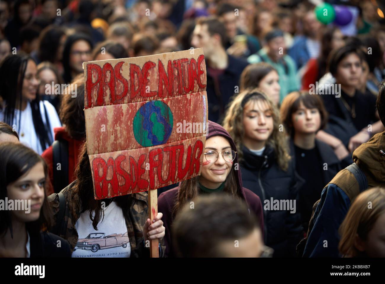 A student holds a placard reading 'No Nature, No Future'. Following the call of Greta Thunberg for a World School Strike, thousands of school students and students took to the streets of Toulouse to denounce the governments inaction towards the climate crisis and demanding stronger action to rein in climate change. They demand to governments do more to protect the environment. The protests come ahead of the annual U.N. climate conference that starts in Madrid on Monday. Similar protests took place all over the world. Toulouse. France. November 29th 2019. (Photo by Alain Pitton/NurPhoto) Stock Photo