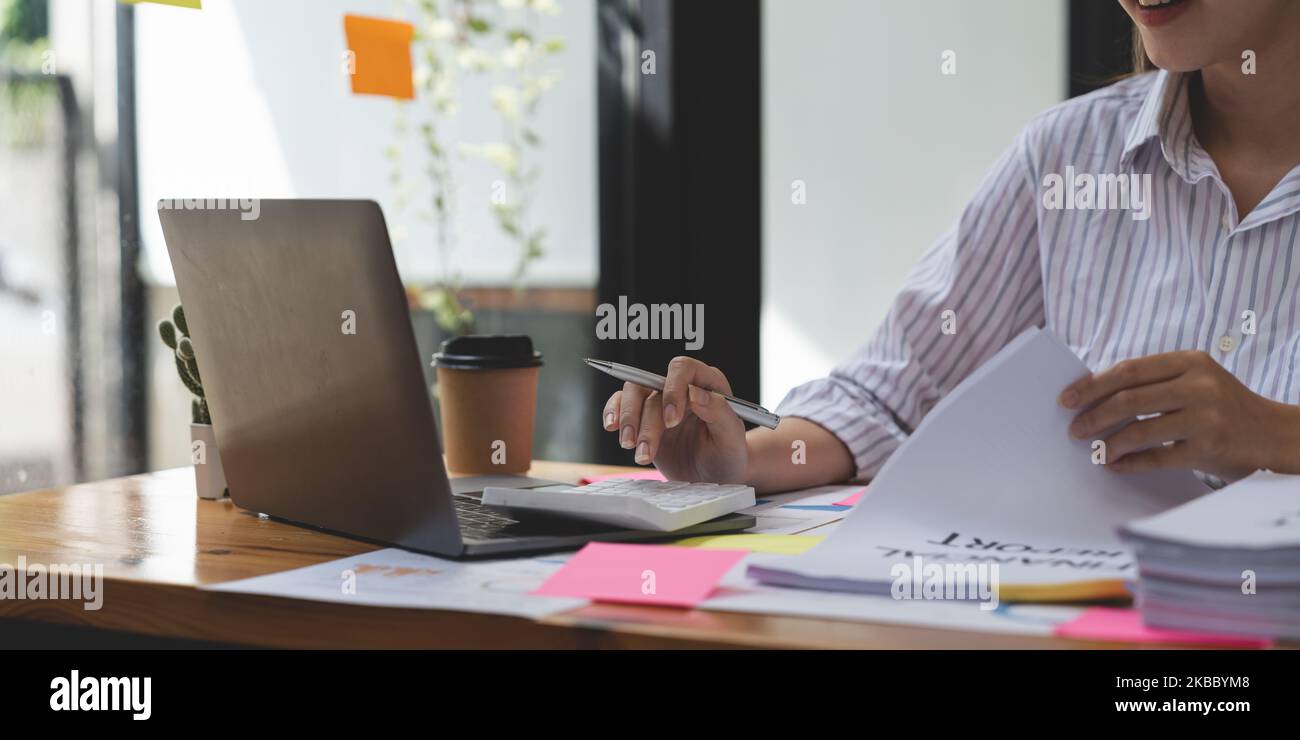 accounting concept. businesswoman working using calculator with money ...