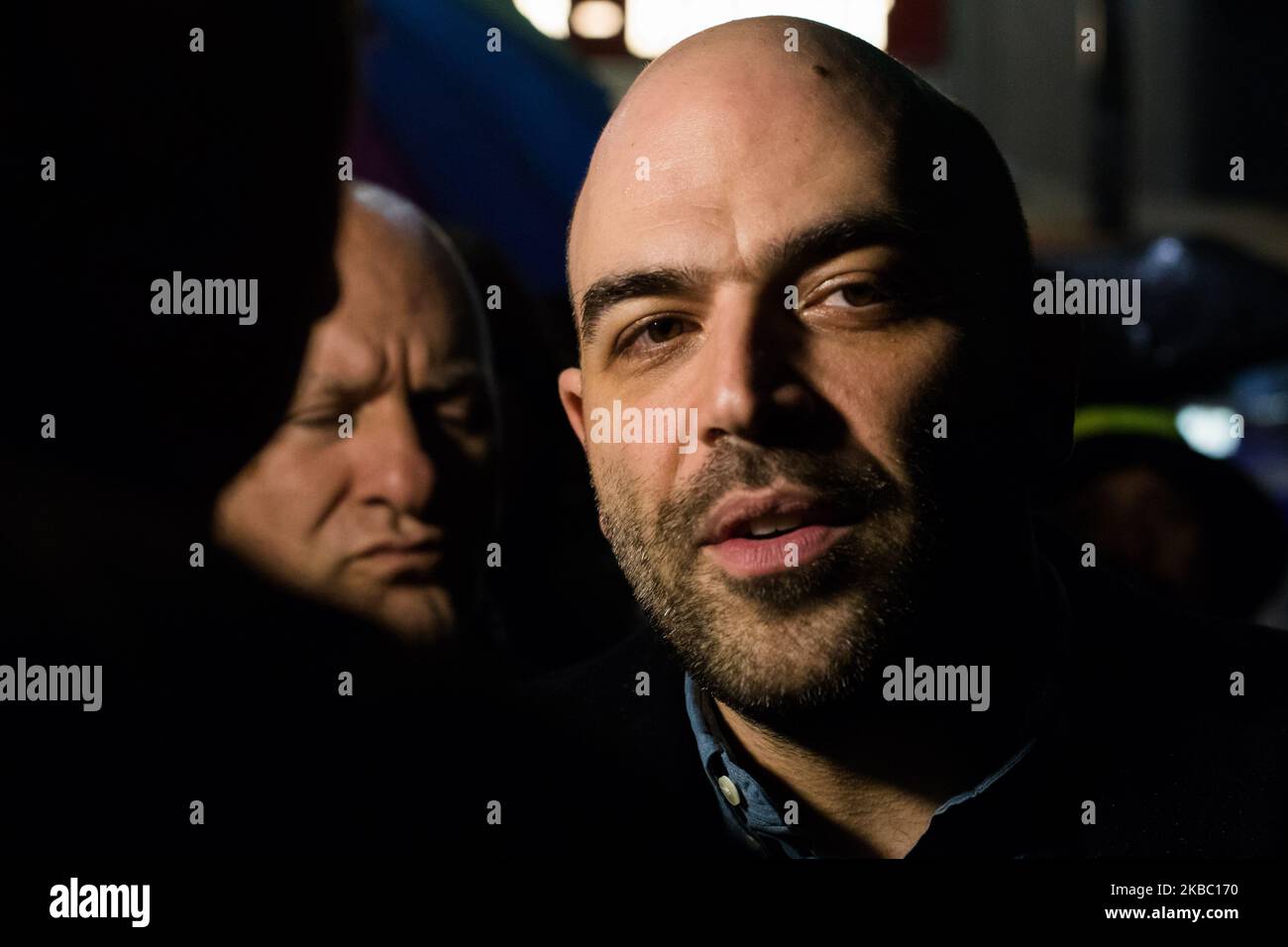 Milan, Italy, Sunday, December 01, 2019. Roberto Saviano toghether with thousands of people gathered in Piazza Duomo in Milan for the ‘Sardine’ movement, to demonstrate against Salvini the leader of the 'Lega nord' to reassert values of tolerance and moderation. The people create a collective singsong, involving the old Resistance favourite, Bella Ciao. (Photo by Mauro Ujetto/NurPhoto) Stock Photo