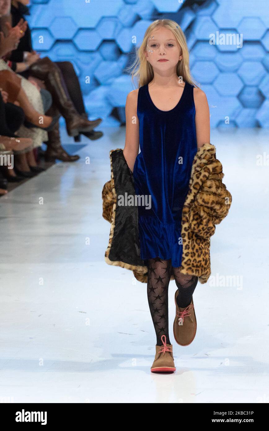 A model walks the runway at the Coyote Pretty collection for Spring and Summer 2020 during the third annual Toronto Kids Fashion Week fashion show on November 30, 2019 in Toronto, Canada (Photo by Anatoliy Cherkasov/NurPhoto) Stock Photo