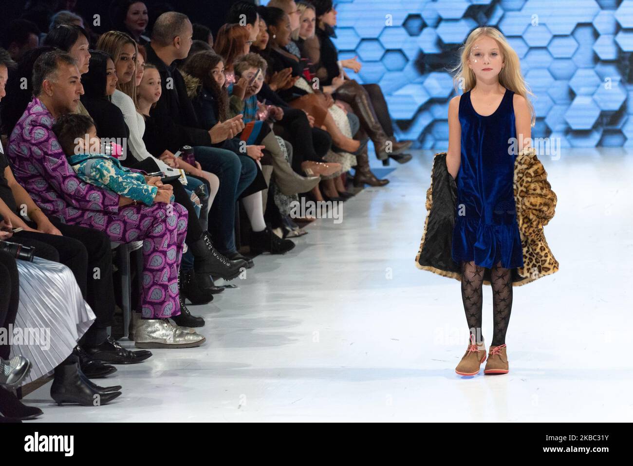 A model walks the runway at the Coyote Pretty collection for Spring and Summer 2020 during the third annual Toronto Kids Fashion Week fashion show on November 30, 2019 in Toronto, Canada (Photo by Anatoliy Cherkasov/NurPhoto) Stock Photo