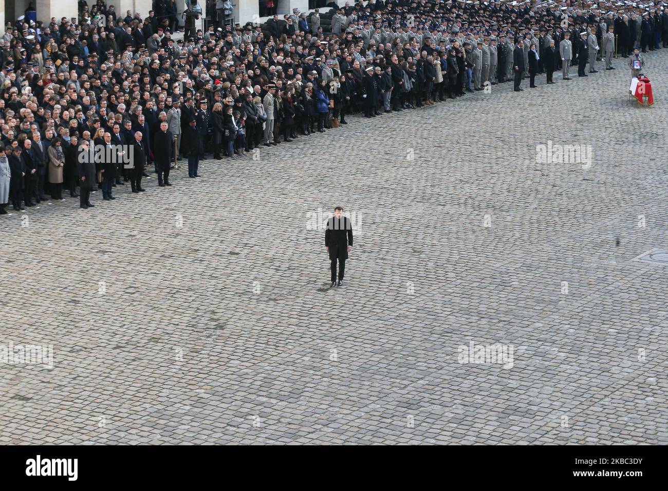 France's President Emmanuel Macron (C) crosses alone the Invalide monument during a tribute ceremony on December 2, 2019 at the Invalides monument, in Paris, for the 13 French soldiers killed in Mali. In its biggest military funeral in decades, France is honoring 13 soldiers killed when their helicopters collided over Mali while on a mission fighting extremists affiliated with the Islamic State group. (Photo by Michel Stoupak/NurPhoto) Stock Photo