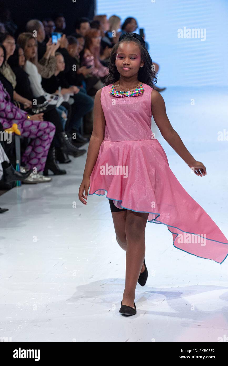 A model walks the runway at the Young Socialites collection for Spring and Summer 2020 during the third annual Toronto Kids Fashion Week fashion show on November 30, 2019 in Toronto, Canada (Photo by Anatoliy Cherkasov/NurPhoto) Stock Photo