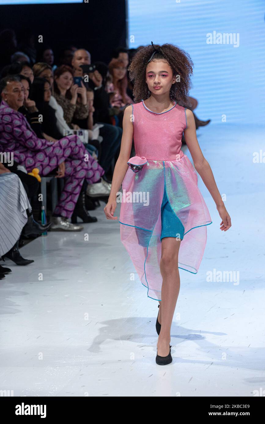 A model walks the runway at the Young Socialites collection for Spring and Summer 2020 during the third annual Toronto Kids Fashion Week fashion show on November 30, 2019 in Toronto, Canada (Photo by Anatoliy Cherkasov/NurPhoto) Stock Photo