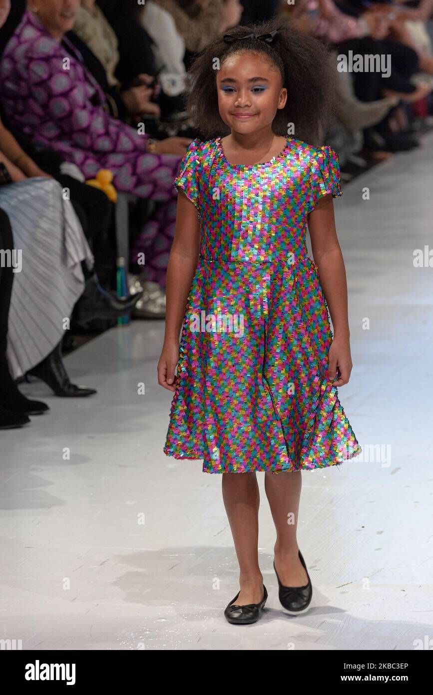 A model walks the runway at the Young Socialites collection for Spring and Summer 2020 during the third annual Toronto Kids Fashion Week fashion show on November 30, 2019 in Toronto, Canada (Photo by Anatoliy Cherkasov/NurPhoto) Stock Photo