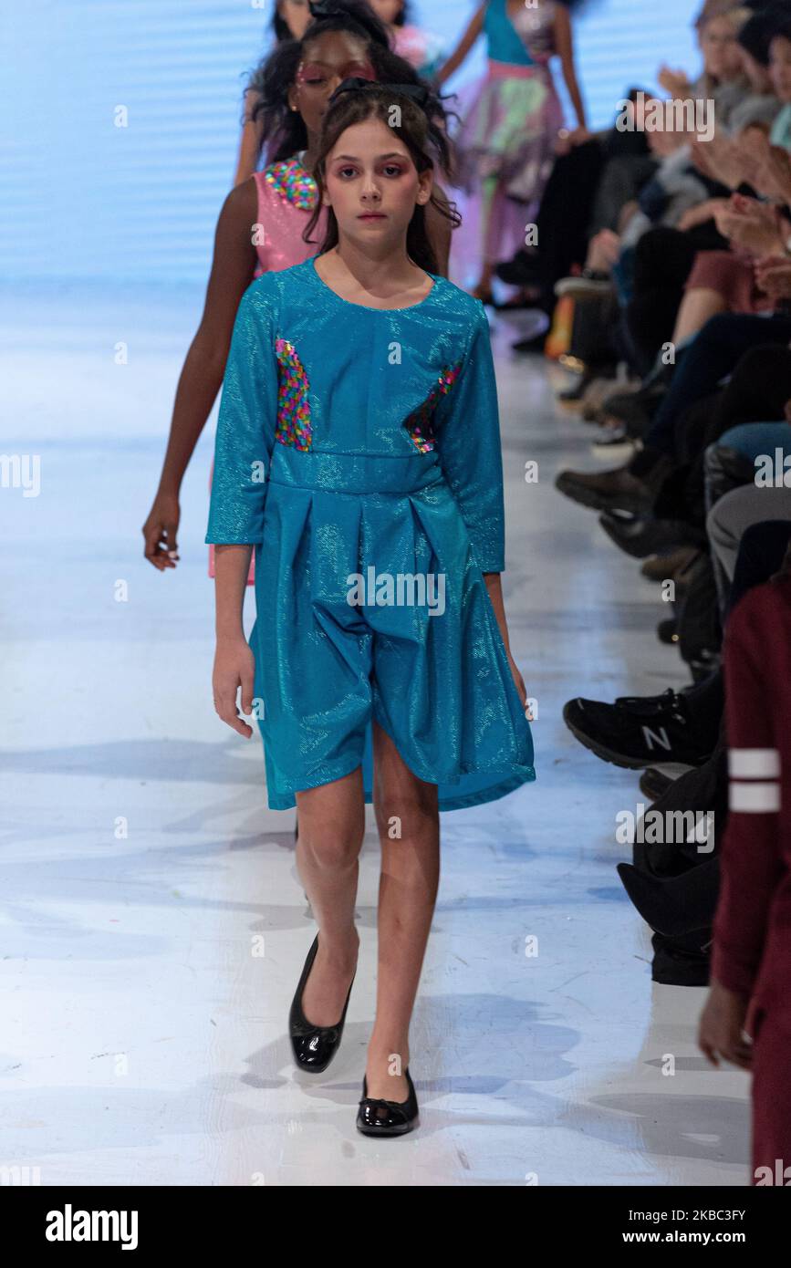 A model walks the runway at the Young Socialites collection for Spring and Summer 2020 during the third annual Toronto Kids Fashion Week fashion show on November 30, 2019 in Toronto, Canada (Photo by Anatoliy Cherkasov/NurPhoto) Stock Photo