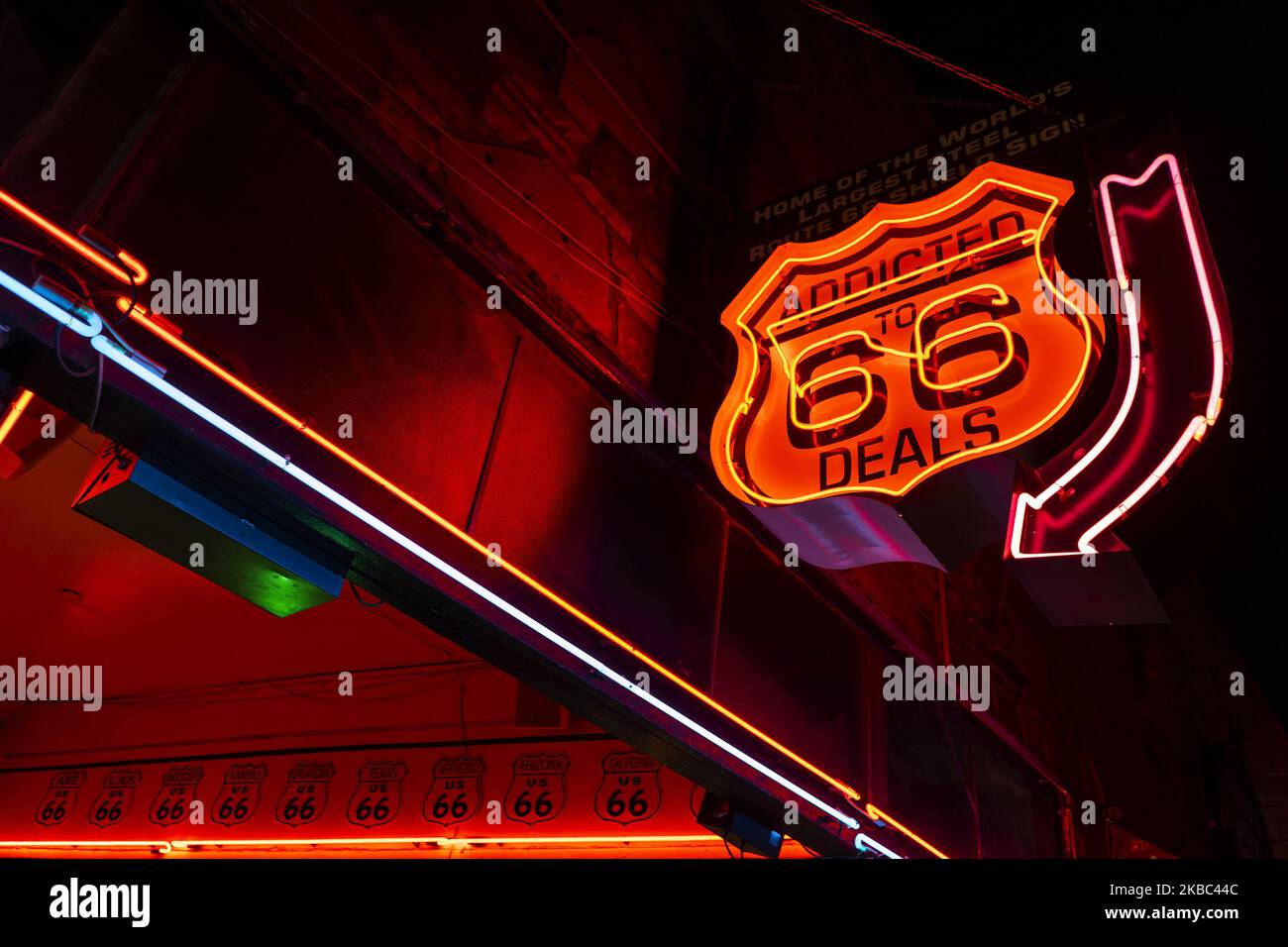 Neon sign of a souvenir shop with the Route 66 on 13 November 2019. logo in Williams (Arizona), Williams is one of the usual stops on Route 66 on 13 November 2019. Traveling along historic Route 66 in Arizona becomes a search for “typical” corners that remind of the atmosphere it had in the 50s and 60s of the last century, when it was the most frequent route used by vacationers than since the Central United States wanted to reach the coast of California.Today this route has been relegated to the background after the creation of Interstate 40, but if you go from Las Vegas to the Grand Canyon of Stock Photo