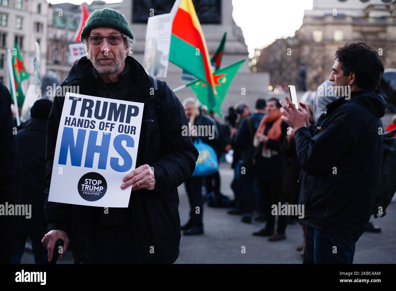 An activist carries a placard opposing any post-Brexit US market access to Britain's National Health Service (NHS) at a protest against US President Donald Trump in Trafalgar Square in London, England, on December 3, 2019. President Trump arrived in the UK on a three-day visit last night, chiefly to attend tomorrow's NATO summit in Watford. He is tonight attending a reception for NATO leaders with Queen Elizabeth at Buckingham Palace. Trump today stated that he wanted 'absolutely nothing' to do with the NHS when asked if it would form part of any post-Brexit trade talks. (Photo by David Cliff/ Stock Photo