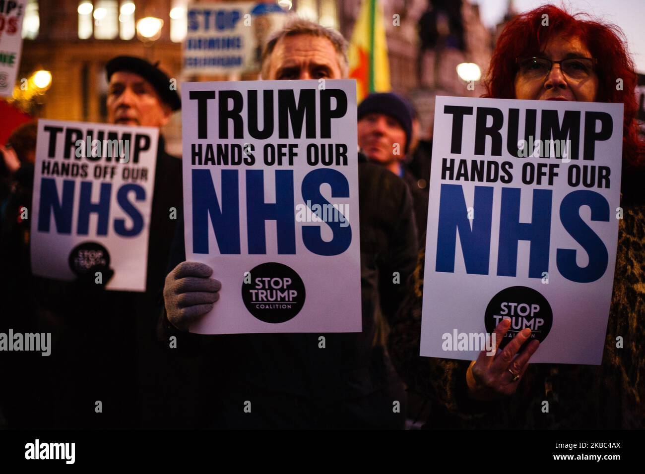 Activists carry placards opposing any post-Brexit US market access to Britain's National Health Service (NHS) at a protest against US President Donald Trump in Trafalgar Square in London, England, on December 3, 2019. President Trump arrived in the UK on a three-day visit last night, chiefly to attend tomorrow's NATO summit in Watford. He is tonight attending a reception for NATO leaders with Queen Elizabeth at Buckingham Palace. Trump today stated that he wanted 'absolutely nothing' to do with the NHS when asked if it would form part of any post-Brexit trade talks. (Photo by David Cliff/NurPh Stock Photo