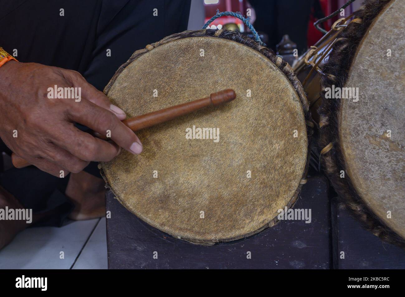 Indigenous people play traditional musical instruments accompanying the ...
