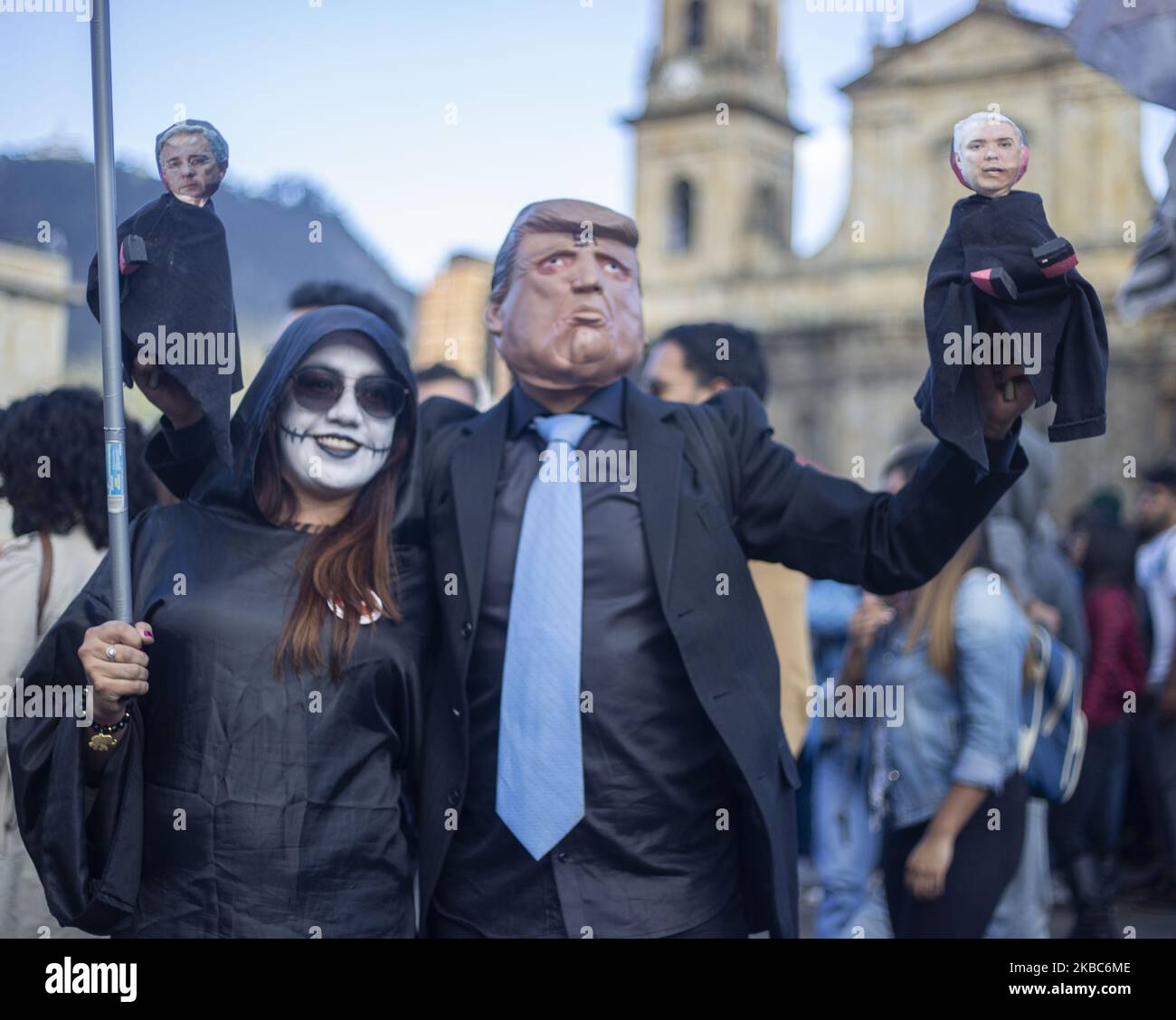 A person with the mask of the president of the United States, Donald Trump is seen during the third national strike in the city of Bogota, Colombia, on 4 December 2019. This is the third national strike in two weeks amid ongoing protests against social, security and economic policies of President Ivan Duque. Five people have died in connection with the protests since November 21. (Photo by Daniel Garzon Herazo/NurPhoto) Stock Photo
