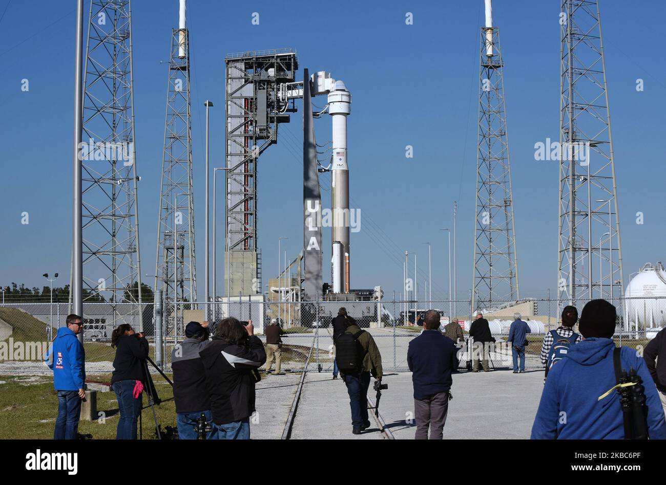 Members of the media photograph Boeing's first CST-100 Starliner spacecraft as it sits atop a United Launch Alliance Atlas V rocket on pad 41 at Cape Canaveral Air Force Station on December 4, 2019 in Cape Canaveral, Florida. The Starliner crew capsule, designed to carry as many as seven astronauts to the International Space Station (ISS), is scheduled to make its first unmanned test flight to the ISS on December 19. (Photo by Paul Hennessy/NurPhoto) Stock Photo