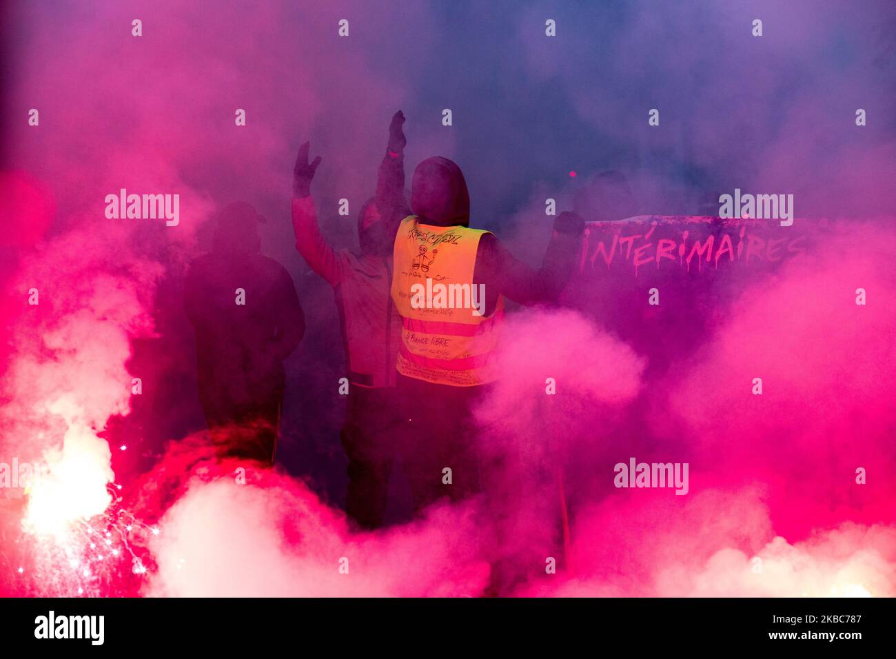 Paris, France, December 5, 2019. Demonstrators in smoke during clashes between black block and police at the demonstration against the government's pension reform plan and to defend public service. (Photo by Emeric Fohlen/NurPhoto) Stock Photo