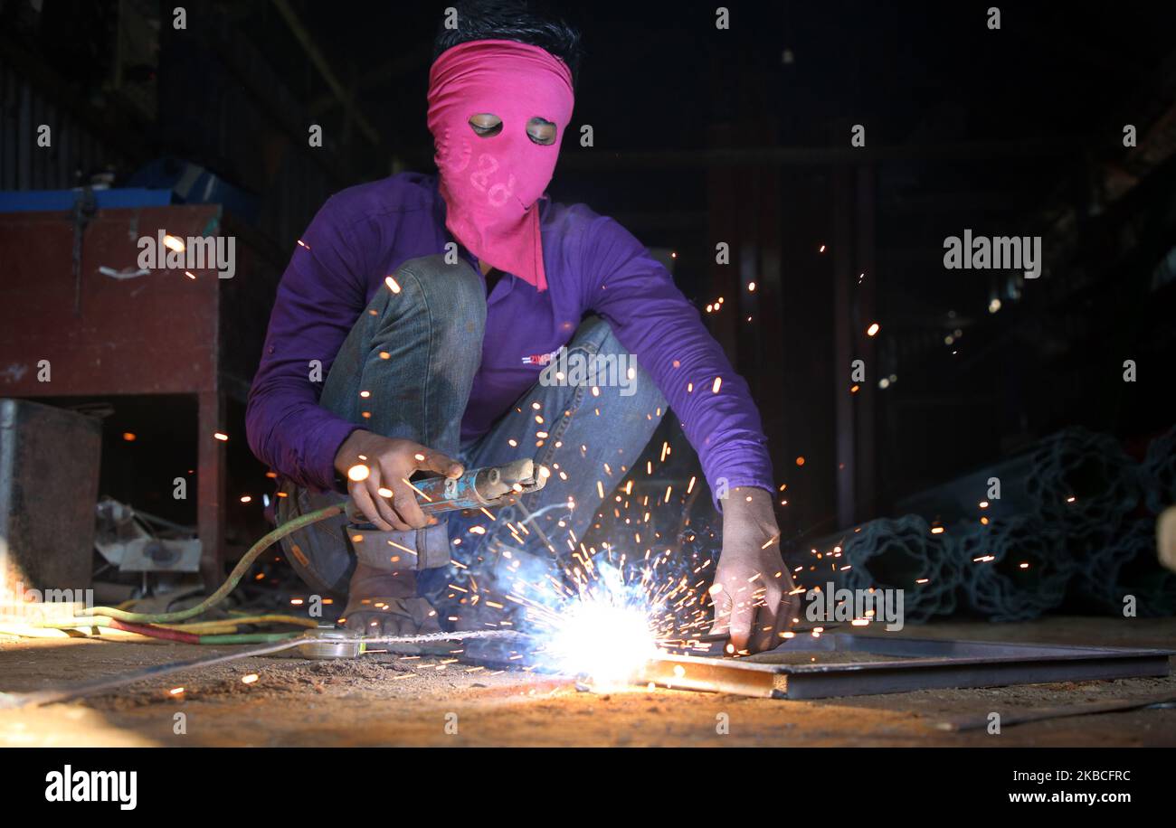 Child labour performing risky welding job on 9 December 2019 in Dhaka