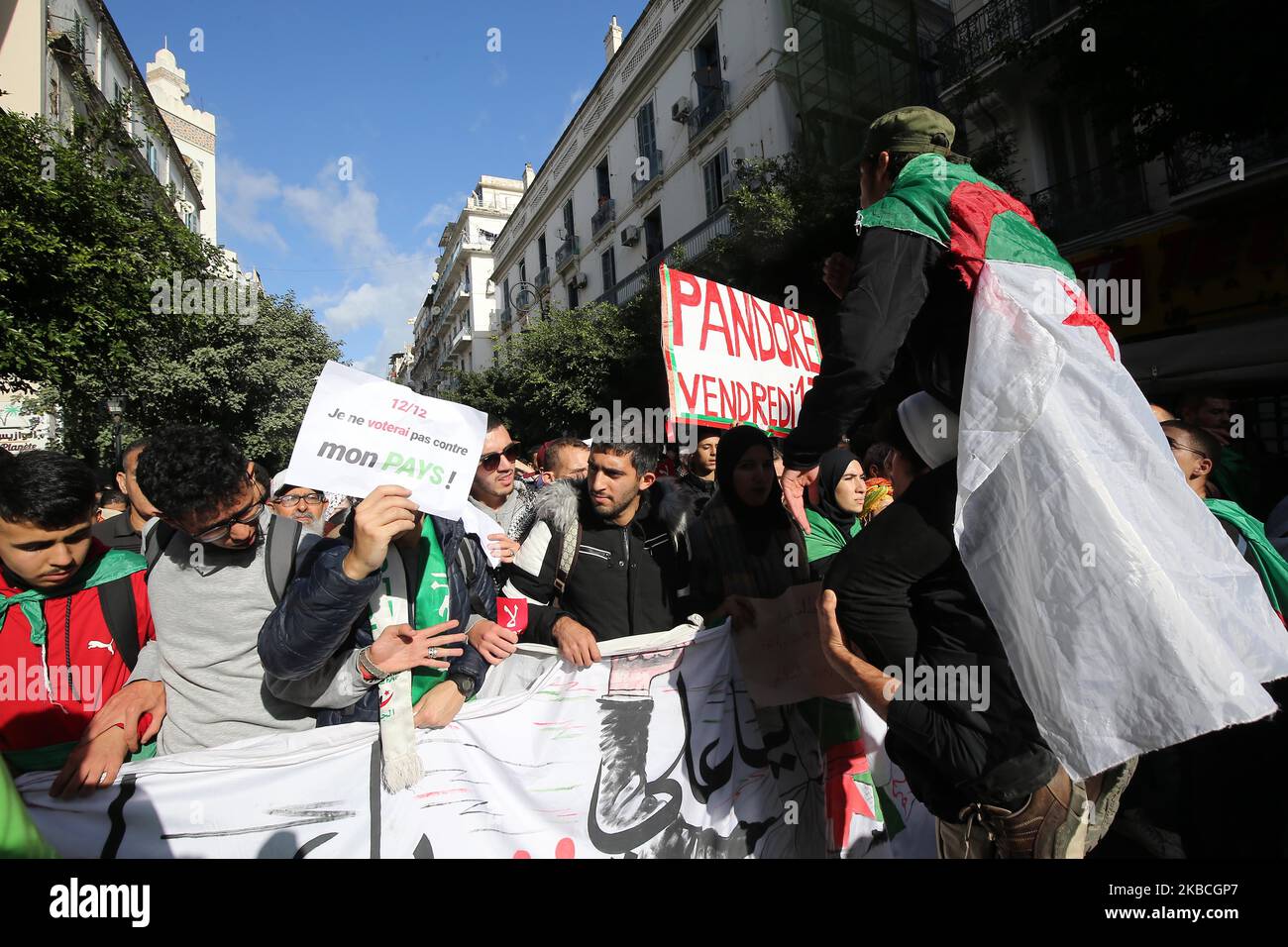Algerians chant slogans as they march during an anti-government demonstration in Algiers, Algerian, 10 December 2019. The demonstration is against the upcoming presidential election scheduled for 12 December (Photo by Billal Bensalem/NurPhoto) Stock Photo