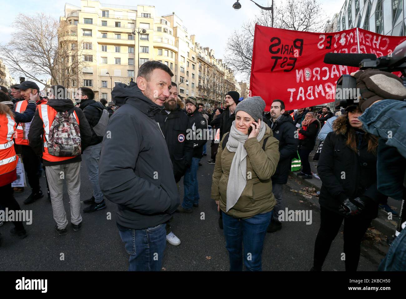 French far-left New Anti-Capitalist Party (NPA) member Olivier Besancenot (C) takes part in a demonstration on December 10, 2019 in Paris as part of the sixth day of a strike of public transport operators SNCF and RATP employees over French government's plan to overhaul the country's retirement system. Unions have vowed to keep up the fight over the reforms, which are set to be finalised and published on December 11. (Photo by Michel Stoupak/NurPhoto) Stock Photo