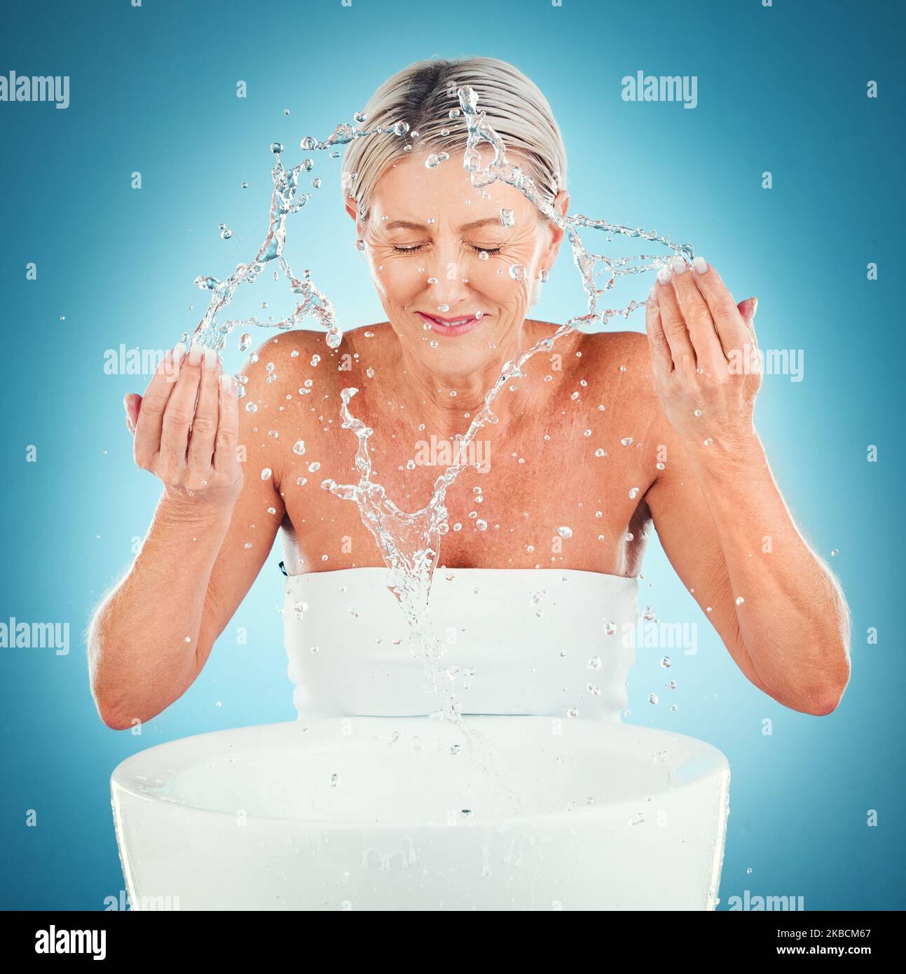Splash beauty, senior and skincare for woman in studio for grooming 