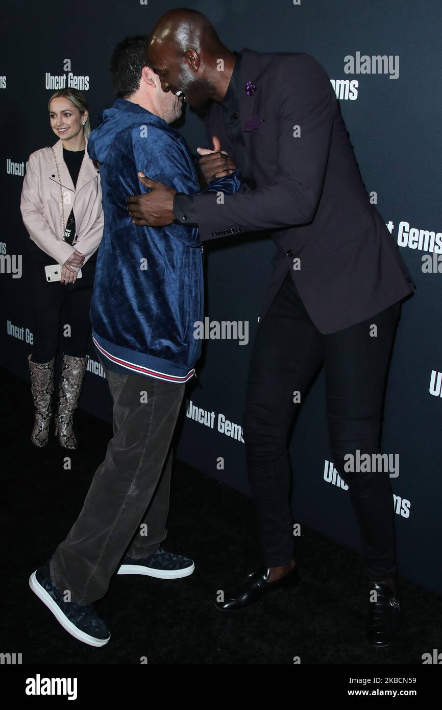 HOLLYWOOD, LOS ANGELES, CALIFORNIA, USA - DECEMBER 11: Adam Sandler and Kevin Garnett arrive at the Los Angeles Premiere Of A24's 'Uncut Gems' held at the ArcLight Cinerama Dome on December 11, 2019 in Hollywood, Los Angeles, California, United States. (Photo by Xavier Collin/Image Press Agency/NurPhoto) Stock Photo