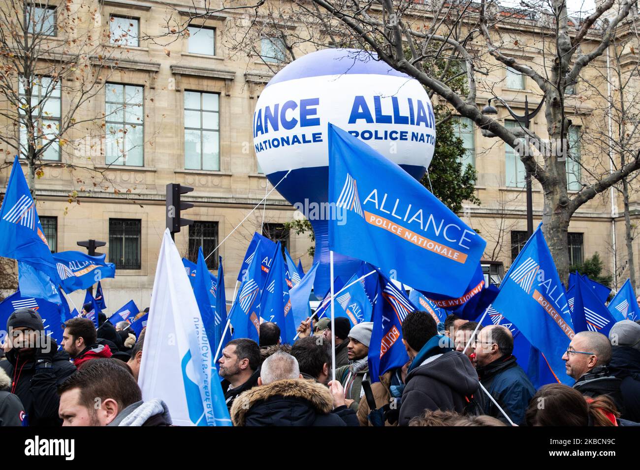 Demonstration of police officers against the reform of pensions framed by barriers and cops (gendarmes), in front of the Economic and Social Council. Flags of Union Alliance National Police. Paris, December 11, 2019. (Photo by Jerome Gilles/NurPhoto) Stock Photo