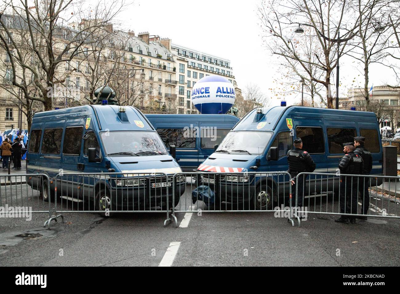 Demonstration of police officers against the reform of pensions framed by barriers and cops (gendarmes), in front of the Economic and Social Council. Flags of Union Alliance National Police. Paris, December 11, 2019. (Photo by Jerome Gilles/NurPhoto) Stock Photo