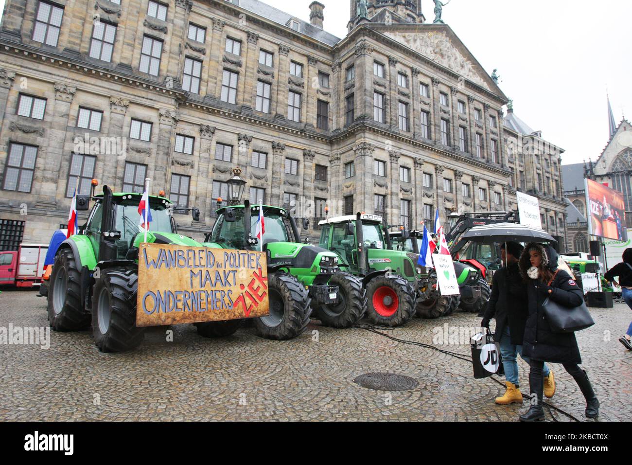 Dutch farmers protest with their tractors against government's agriculture  policy in front of the Royal Palace at the Dam square on December 13, 2019  in Amsterdam,Netherlands. The representative of Agricultural and  Horticultural