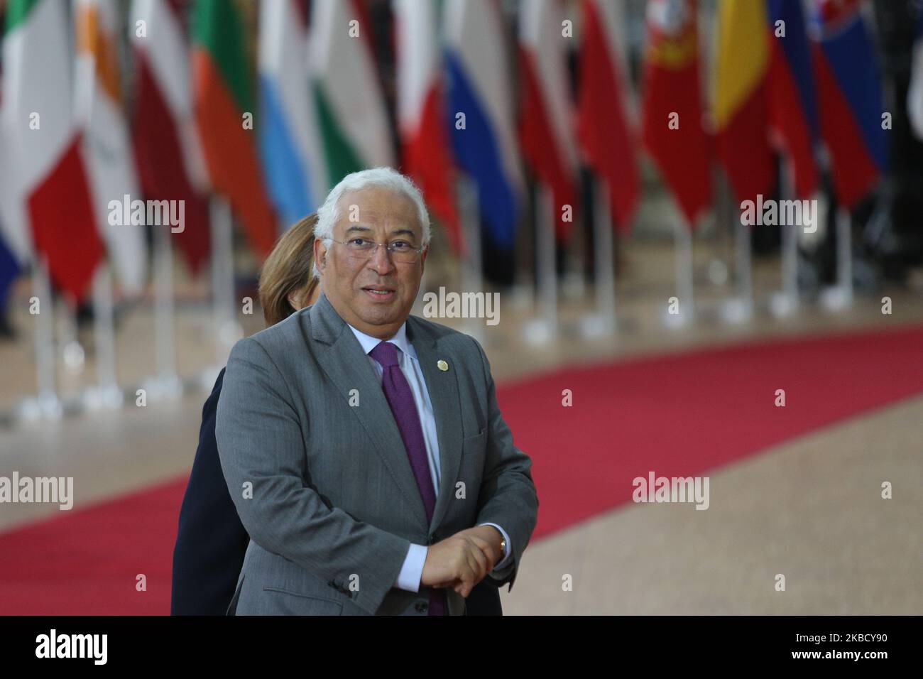 Antonio Costa, the Prime Minister of Portugal arrives on the red carpet with the flags in the background, at the European Council - Euro Summit - EU leaders meeting, in the Forum Europa Building, headquarters of EU. Brussels, Belgium - December 12, 2019 (Photo by Nicolas Economou/NurPhoto) Stock Photo