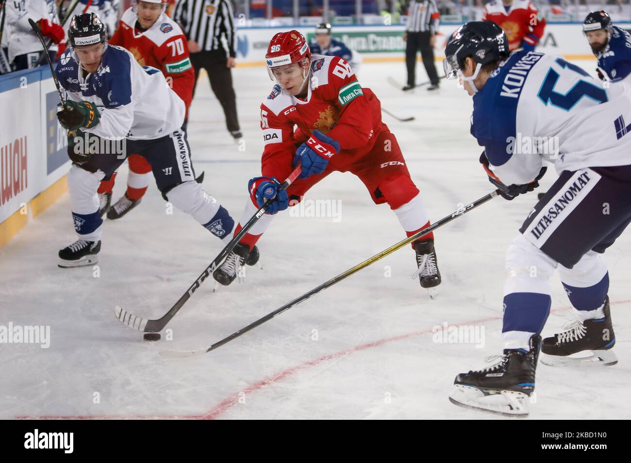 Andrei Kuzmenko (C) of Russia in action against Eemeli Suomi (L) and Miika Koivisto (R) of Finland during the Euro Hockey Tour Channel One Cup ice hockey match between Russia and Finland on December 15, 2019 at Gazprom Arena in Saint Petersburg, Russia. (Photo by Mike Kireev/NurPhoto) Stock Photo