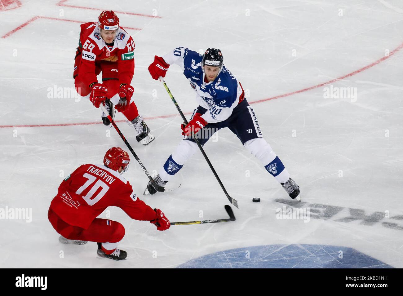Nikita Lyamkin (69) and Vladimir A. Tkachyov (70) of Russia in action against Petteri Lindbohm of Finland during the Euro Hockey Tour Channel One Cup ice hockey match between Russia and Finland on December 15, 2019 at Gazprom Arena in Saint Petersburg, Russia. (Photo by Mike Kireev/NurPhoto) Stock Photo
