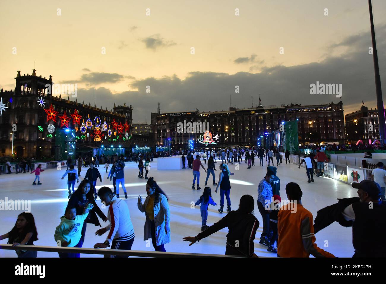 People seen attends the ecological ice rink made of synthetic ice on