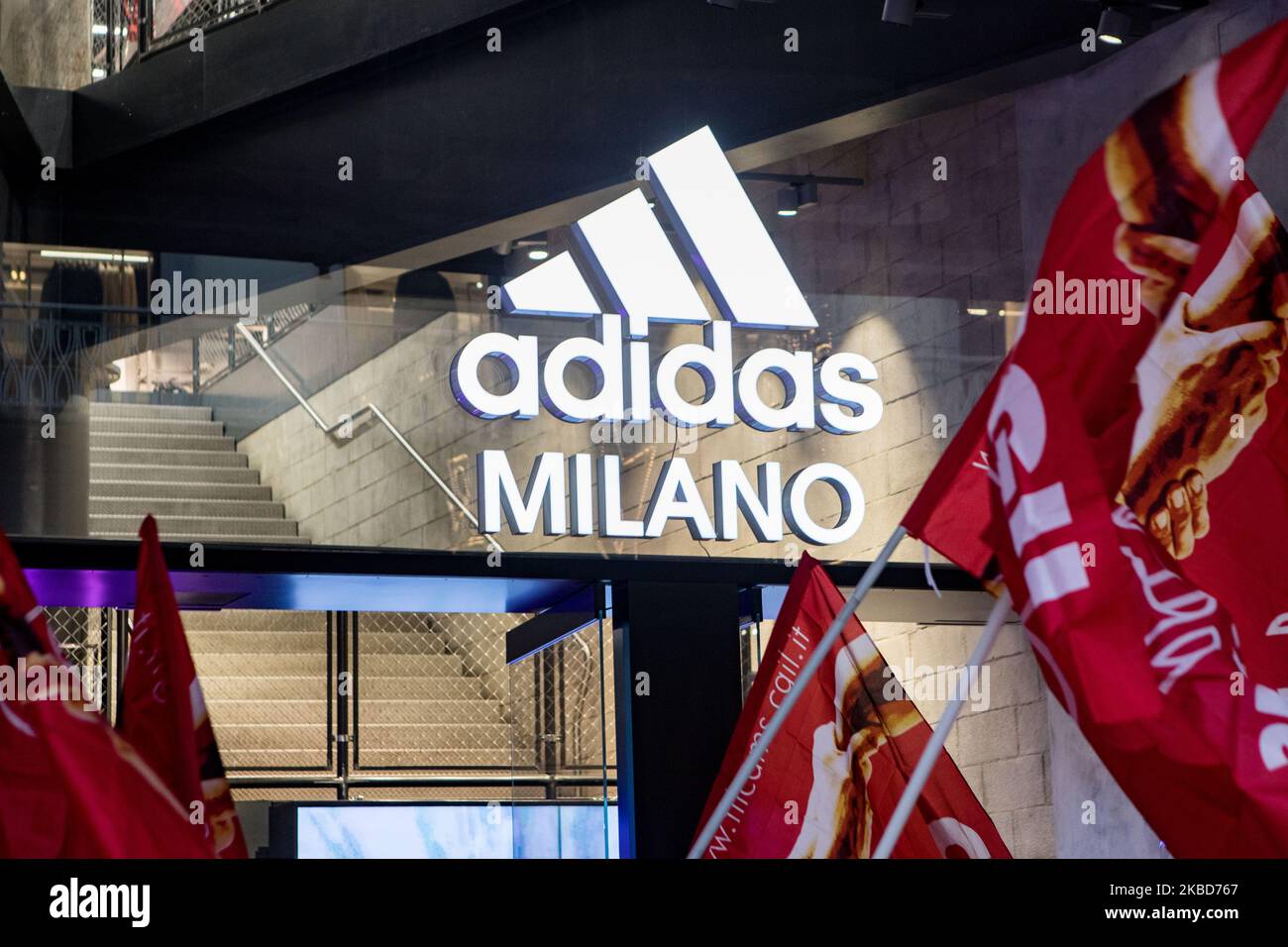 Employees of the well-known clothing brand Adidas protest in front of the Adidas  store in Milan against the 41 dismissals due to the relocation of certain  production activities to Portugal, on December