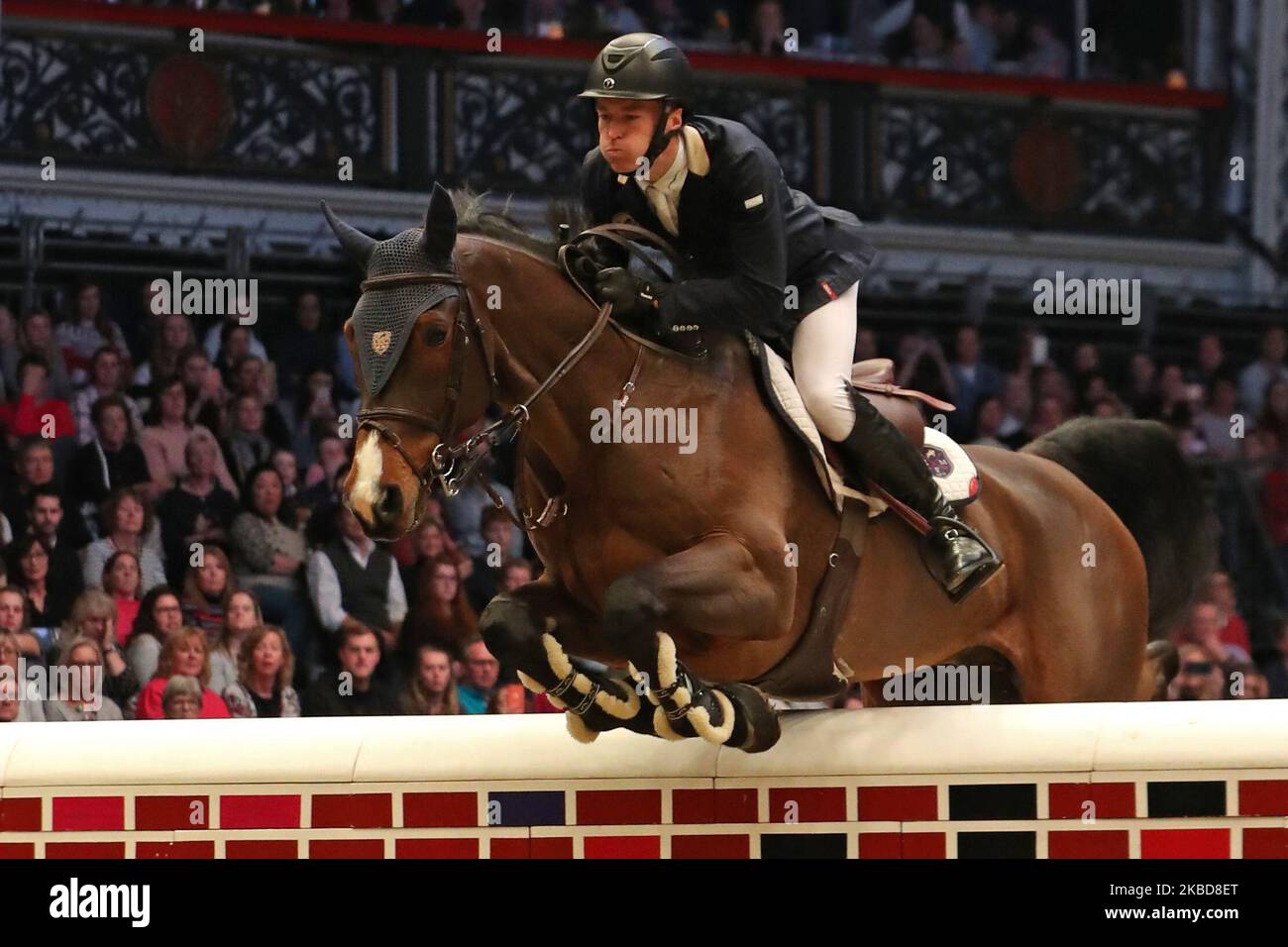 William Whitaker riding RMF Charly during the Cayenne Puissance Event at the International Horse Show at Olympia, London on Wednesday 18th December 2019. (Photo by Jon Bromley/MI News/NurPhoto) Stock Photo