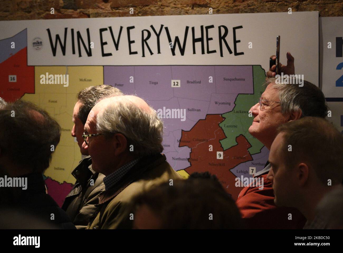 Supporters stand next to a map of Pennsylvania as US presidential hopeful Michael Bloomberg opens a local campaign field office in Philadelphia, PA, on December 21, 2019. The former mayor of New York City is the third Democratic candidate to establish a campaign office in the Keystone state. (Photo by Bastiaan Slabbers/NurPhoto) Stock Photo