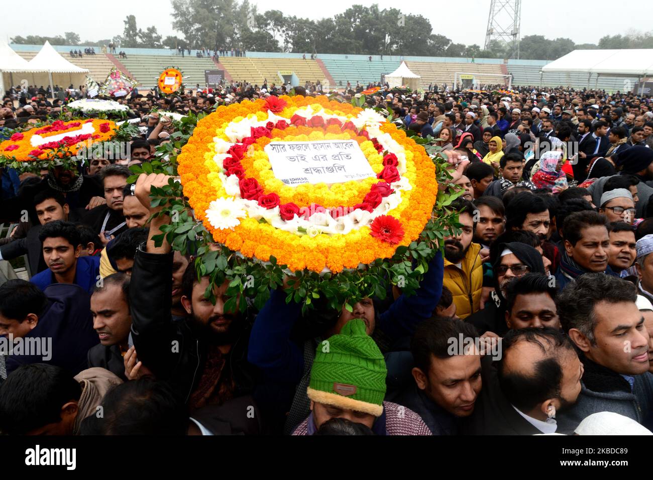 People wait to pay their respects to the late Sir Fazle Hasan Abed, the founder of the Bangladesh Rural Advancement Committee (BRAC), in Dhaka, Bangladesh, on December 22, 2019. Thousands gathered in Bangladesh's capital on December 22 to attend the funeral of Sir Fazle Hasan Abed, founder of BRAC, one of the world's largest NGOs, to show their final respect. (Photo by Mamunur Rashid/NurPhoto) Stock Photo